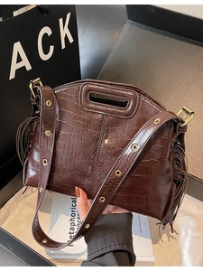 Fashionable dark brown crocodile pattern handbag with side tassels and rivet strap detail