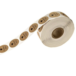 Roll of round kraft paper thank you stickers with black heart for bakery packaging
