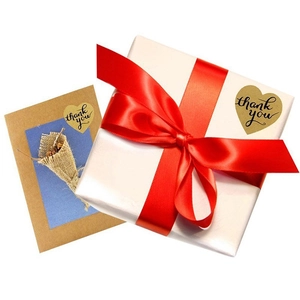 Golden heart-shaped Thank You stickers used for gift box and card sealing