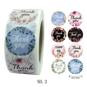 Roll of 1-inch floral Thank You stickers with eight unique botanical wreath designs