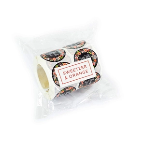Roll of black round Thank You floral stickers by Sweetzer & Orange in clear plastic wrap