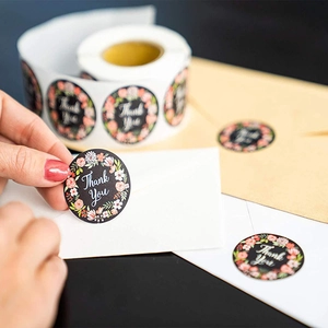 Floral Thank You roll stickers with black background and white font for envelope sealing