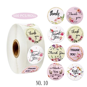 Close-up of 8 floral designs for round adhesive Thank You labels on a 500-piece roll