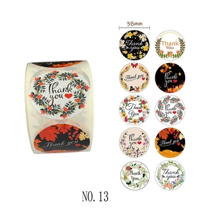 Detail view of 38mm floral Thank You sticker roll with 10 various wreath designs