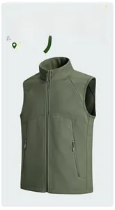 Detail of dark green outdoor functional vest featuring high collar and zip pockets