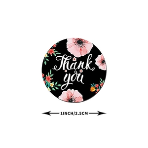 Close-up of 1 inch black floral Thank You sticker for gift sealing and packaging