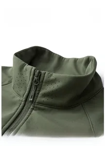 Detailed macro view of standing collar with laser-cut ventilation holes on grid vest