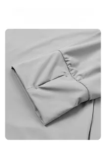 Detail of gray sun protective shirt sleeve with thumbhole and reinforced stitching