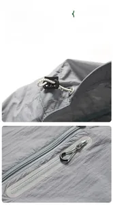 Detailed macro view of water-resistant zippers and adjustable cord locks on sun protection jacket