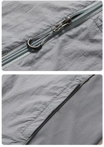 Macro detail of UPF50+ jacket featuring metal zipper and breathable ripstop fabric texture