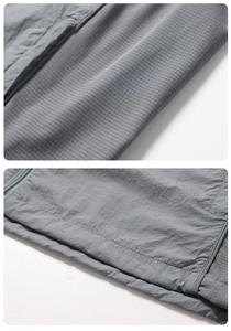Detail of gray UPF 50+ sun protection jacket showing ripstop fabric and seam zipper