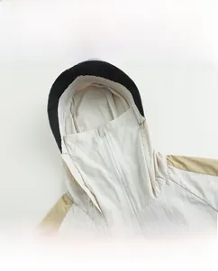 Detail of high collar hoodie with breathable mesh and integrated face mask for sun protection