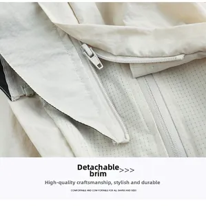 Detail of off-white sun protection jacket showing detachable brim and zipper craft