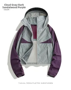 Detail of hooded sun protection jacket in cloud gray and deep sandalwood purple panels