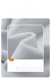 Detailed macro view of light gray thickened polar fleece fabric for outdoor jackets