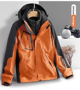 Macro detail of orange 3-in-1 waterproof jacket with zipper pocket and outdoor lettering