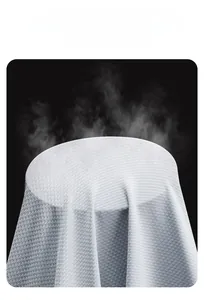 Detail of light gray functional fabric showing high breathability with water vapor penetration