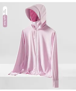 Macro detail of breathable mesh fabric on a soft pink women's sun protection hoodie