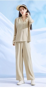 Outdoor detail of women ice silk sun protection jacket and wide leg pants in beige