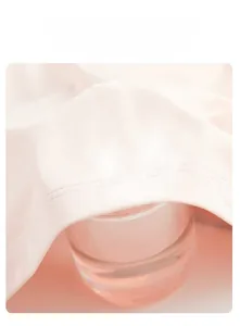Close-up showing the high breathability of light pink sun protection fabric with steam