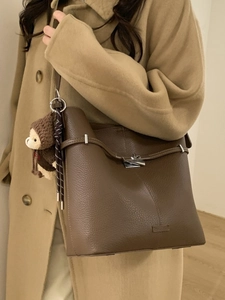 Brown pebbled leather bucket bag with cute bear charm for women casual shoulder wear