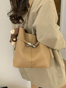 Khaki large capacity leather bucket bag with silver twist lock and cute bear charm