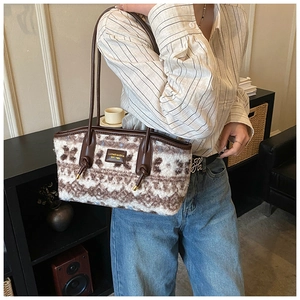 Detail of vintage geometric pattern tote with plush knit texture and leather strap