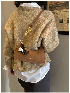 Brown suede hobo bag featuring gold CH initial strap and vintage bohemian charms