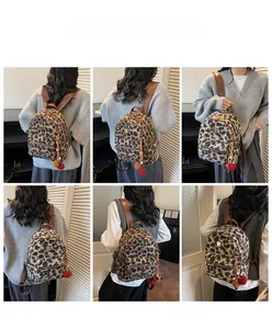 Detailed views of leopard print plush mini backpack with decorative fur pompom charms