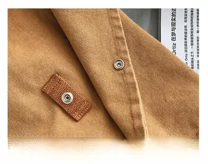Detail of premium canvas tote bag showing heavy-duty hardware snap button and strap
