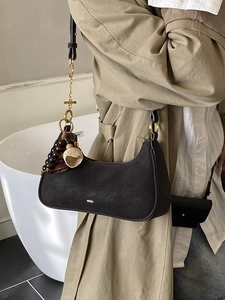 Retro black matte leather hobo bag with vintage gold hardware and beaded charms
