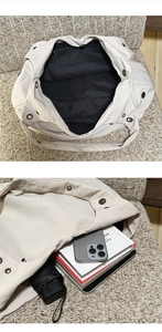 Macro detail of the interior zipper pocket and spacious nylon tote bag capacity
