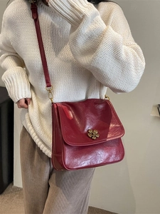 Dark red vintage oil wax leather crossbody bag with a golden floral clasp for women