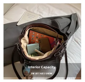 Top view of large capacity dark brown tote bag showing organized interior storage