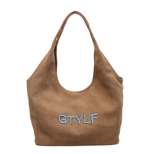Brown canvas tote bag with blue embroidered GTYLF letters and leather straps for women