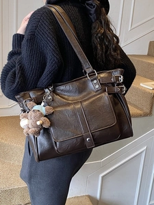 Deep brown retro tote bag with front flap pocket and cute bear charm in city style
