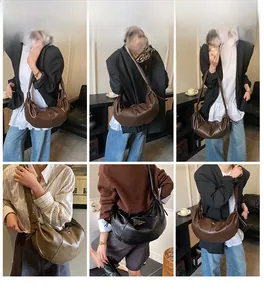 Detailed views of the large capacity crossbody croissant bag worn by a model in several colors