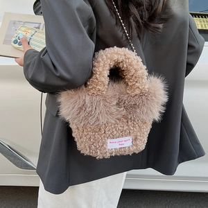 Detail of fuzzy faux fur crossbody bag with chain strap and keep your spirit free tag