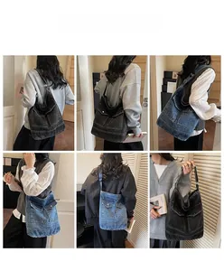 Detail view of large denim tote bag featuring cargo style multi-pockets and metal buckles