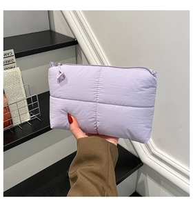 Detailed shot of lavender quilted puff fabric and stylish triangular zipper puller
