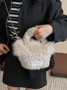 Furry beige crossbody bag with bead chain and Keep Your Spirit Free slogan patch