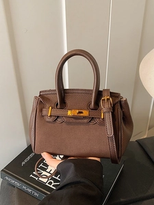 Vintage dark brown pebble leather handbag with gold metal lock and adjustable strap