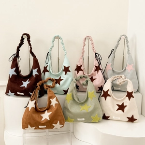Detailed display of star pattern hobo bags in multiple colors with pleated shoulder straps