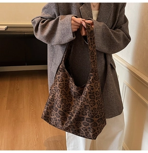 Macro view of leopard print texture and slouchy fabric detail on hobo tote bag