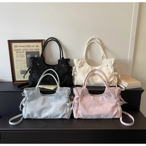 Minimalist large tote bags in four colors with drawstring details and dual handles