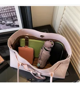 Top view of large capacity pink tote bag interior showing space for tablet and umbrella