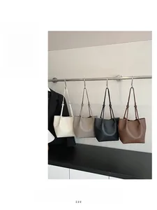 Litchi texture leather bucket bags shown in cream, gray, black, and coffee brown colors