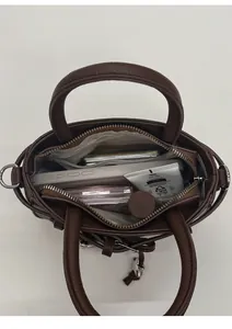 Interior view of brown leather bag showing spacious capacity and daily essentials