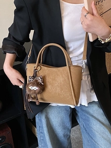 Retro khaki brown bucket bag with leopard print bow charm and dual handles for women