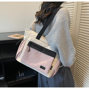Minimalist large-capacity tricolor contrast nylon tote bag shown from 45-degree back view